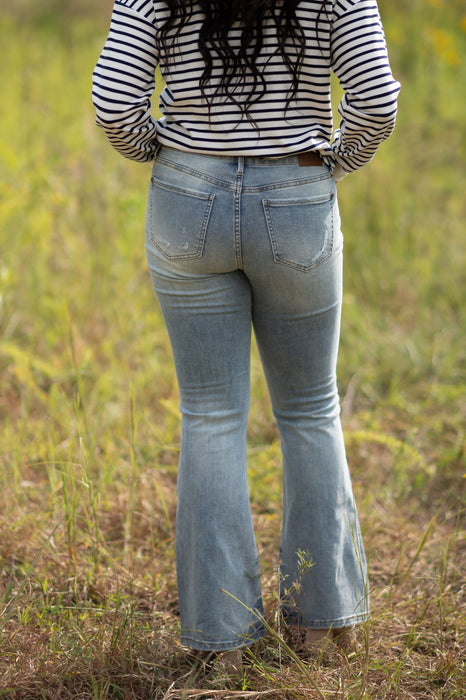 MID RISE TINTED FLARE JEANS