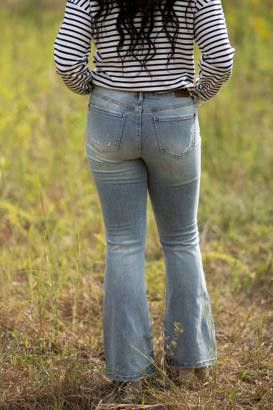 MID RISE TINTED FLARE JEANS